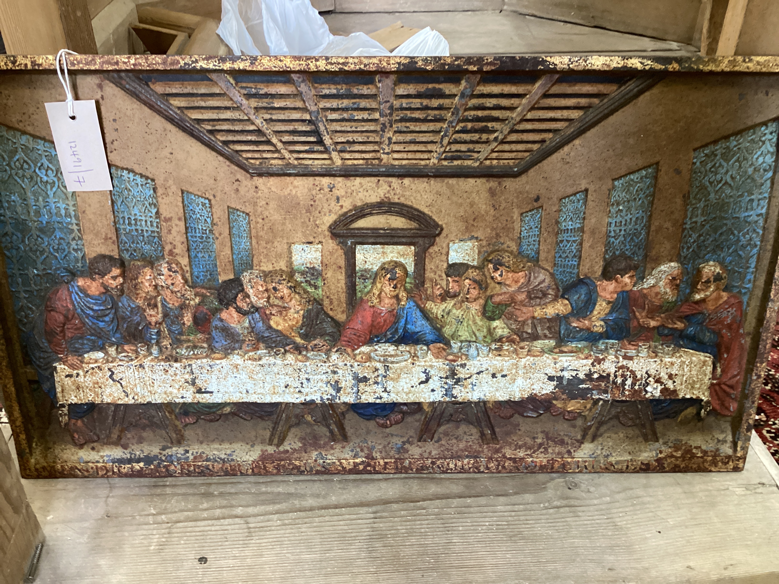A rectangular Coalbrookdale cast iron panel of The Last Supper, later painted, width 66cm, height 37cm
